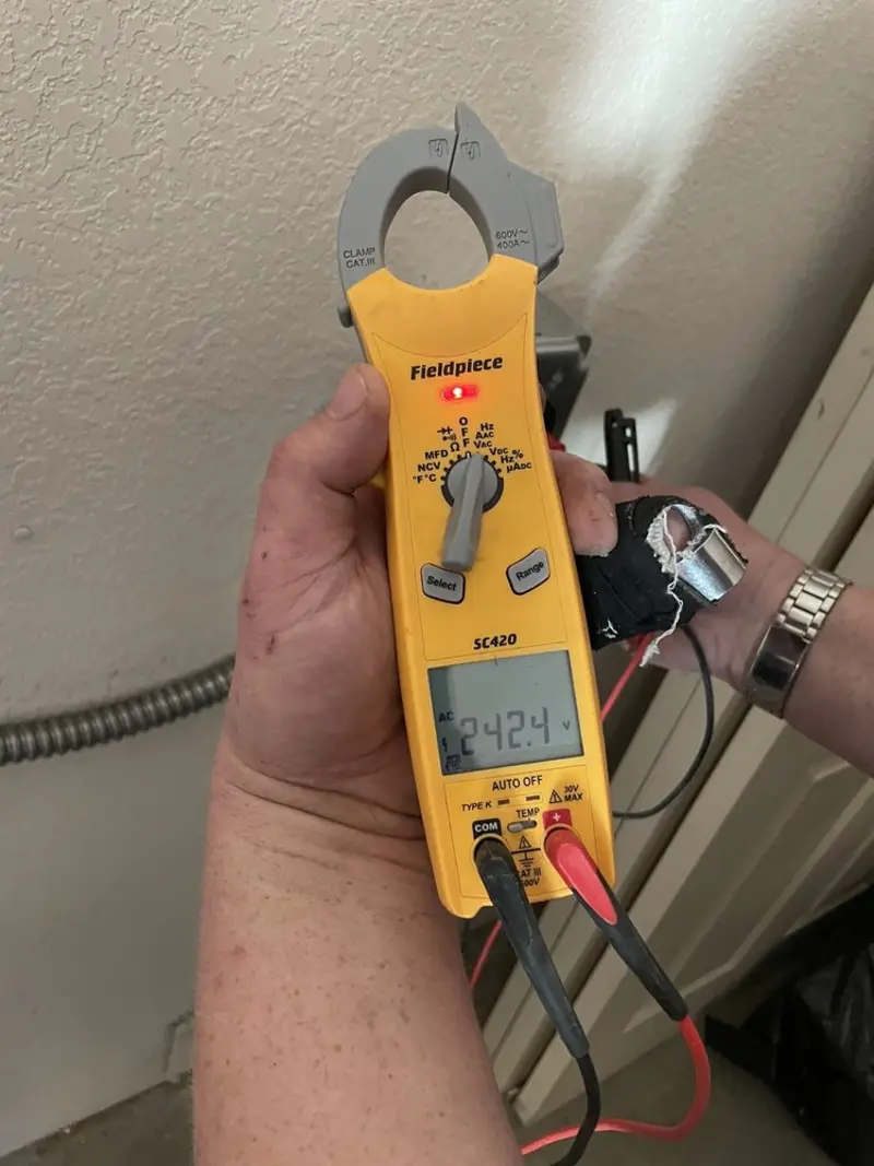 Voltage testing with clamp meter during Ceiling Fan Installation in Basalt